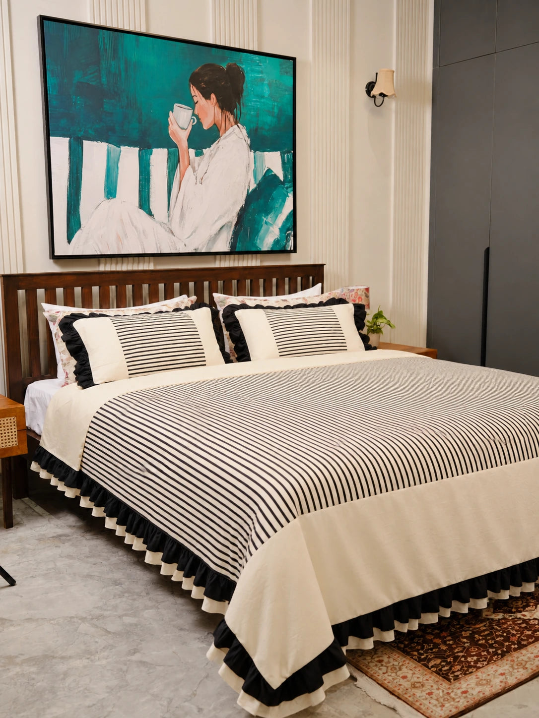 The Colette Cover Set by Uahan — striped cotton duvet cover with black and ivory ruffles on a king bed