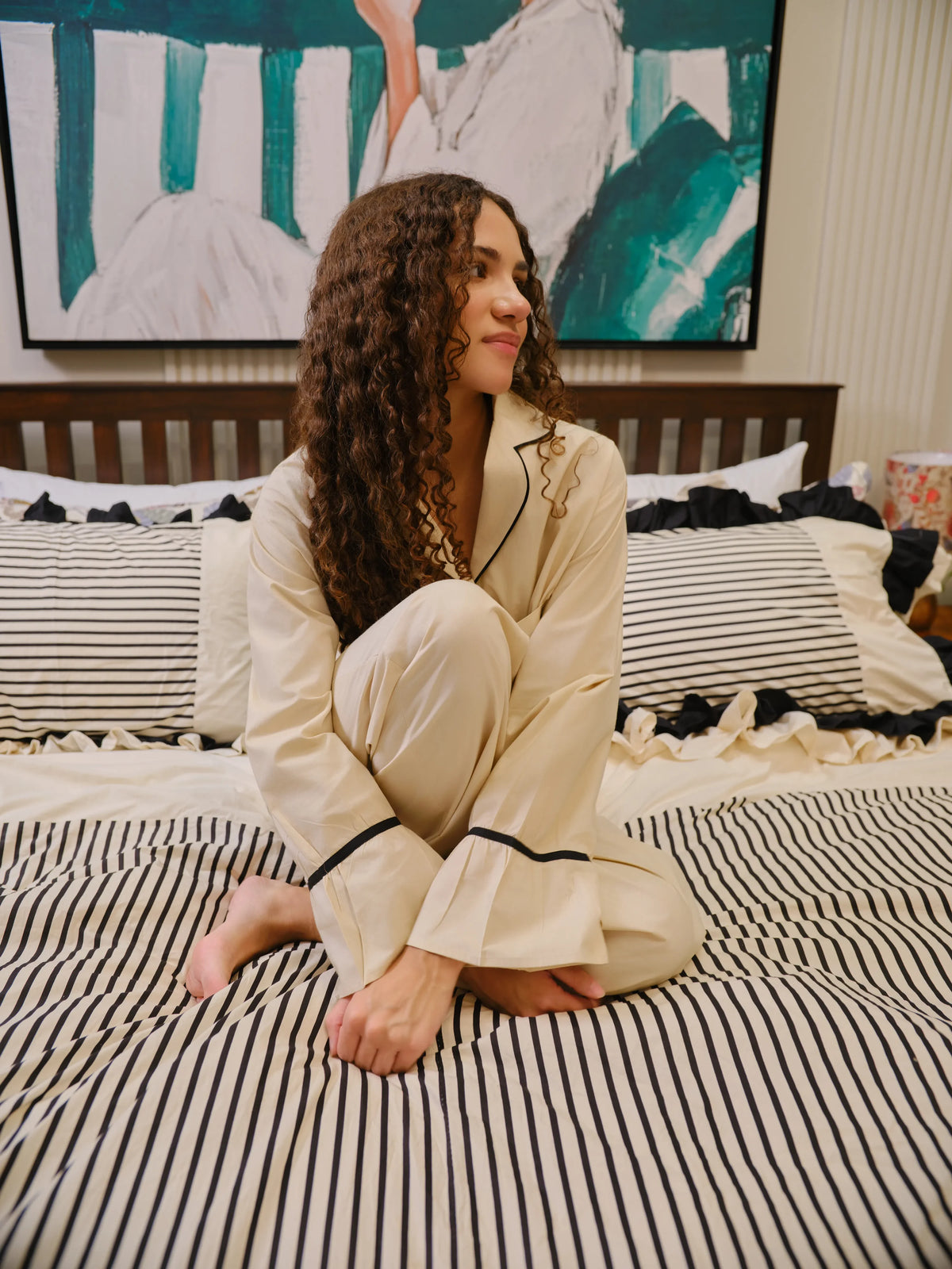 The Madeleine Set by Uahan, sitting on a striped bed